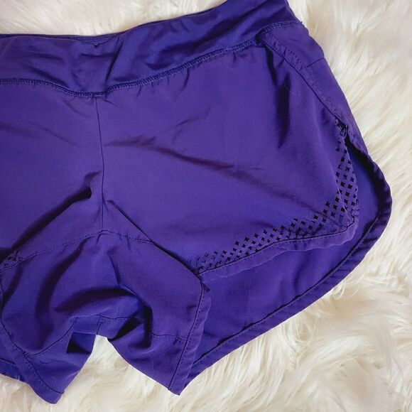 Athleta laser cutout hem purple 3" running shorts - Picture 6 of 10